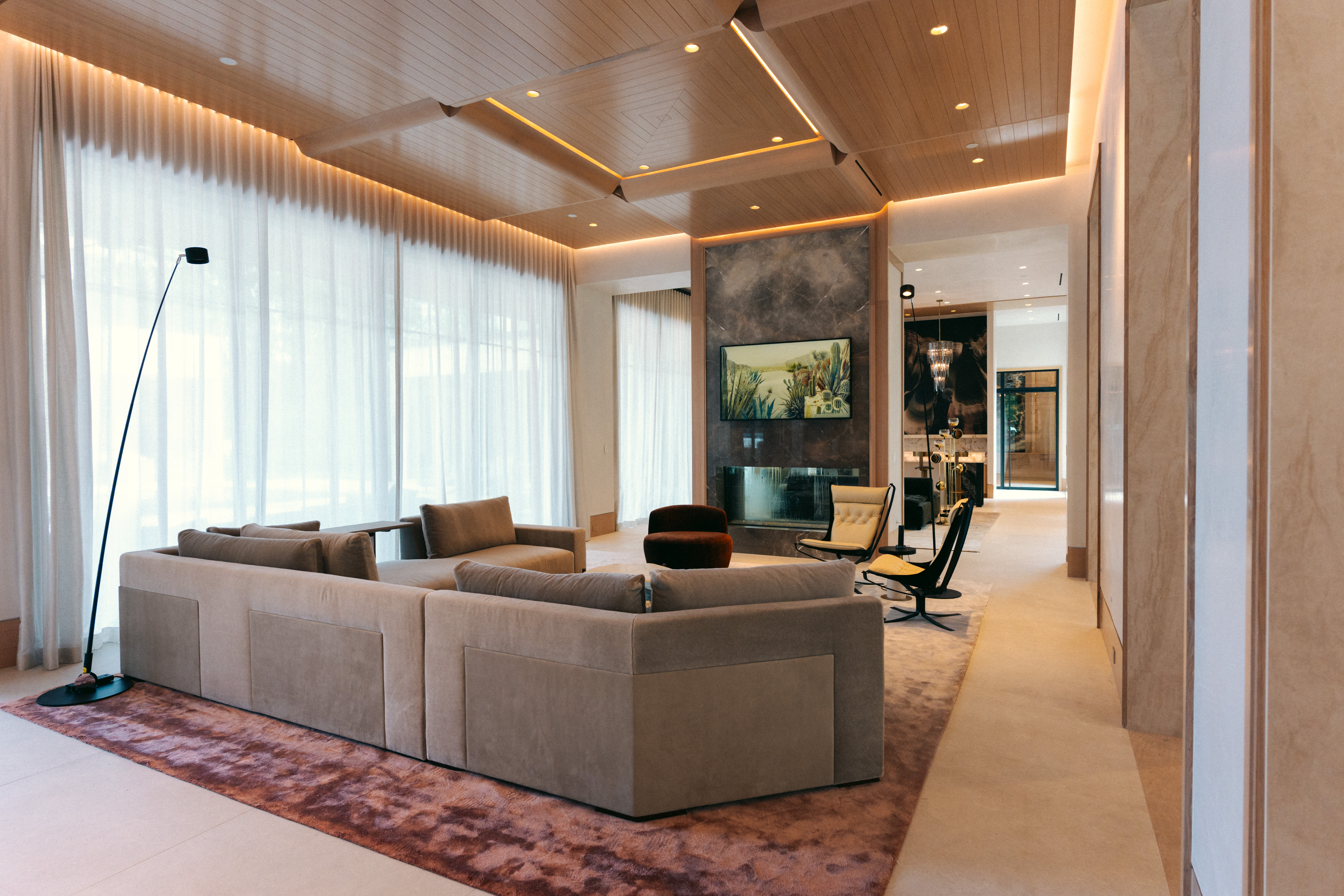 A beautiful lit luxury home — door, entry, and grounds